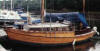 'Chris Hawk' 24'  Strip planked mahogany, the deck is marine ply and the interior is varnished mahogany and ply. 